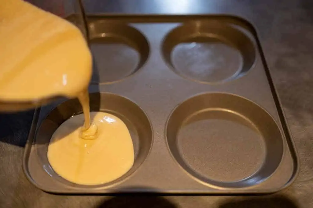 pouring-waffle-batter-into-yorkshire-pudding-tin