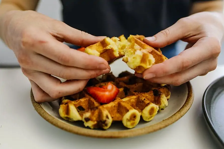 Breaking apart a perfectly cooked waffle