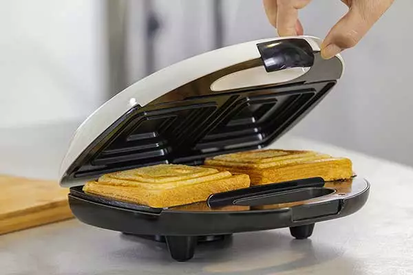 Image of waffles being made in a sandwich maker