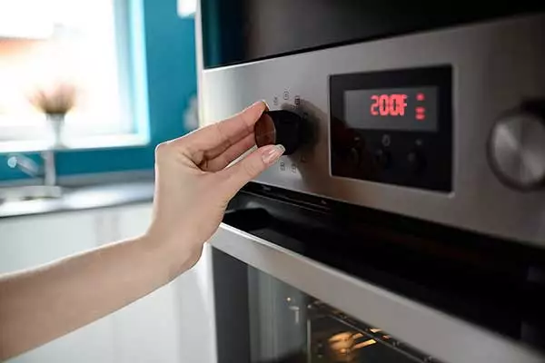 Setting the oven temperature to 200°F