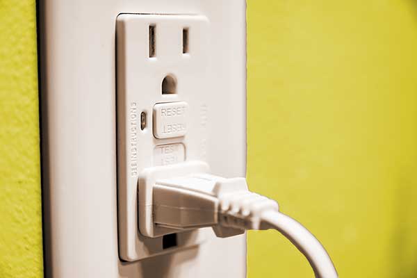 Ground-Fault-Interrupter-Outlet-with-cord-plugged-in