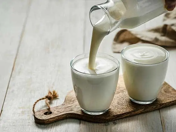 pouring buttermilk into glasses