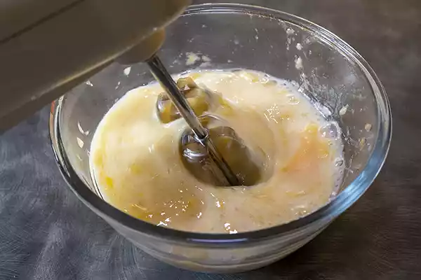 Blending the wet ingredients with a hand mixer