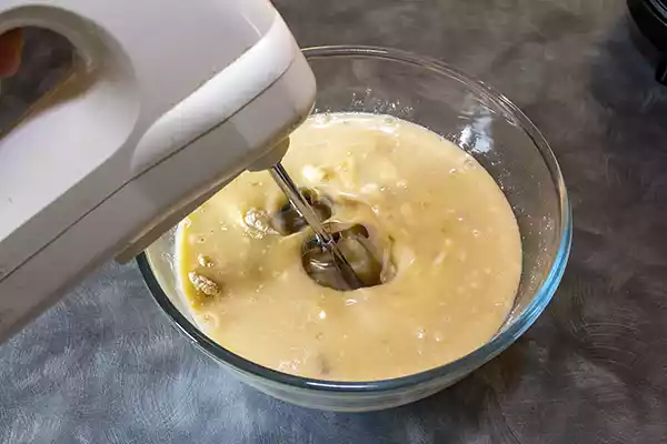 Mix the wet and dry ingredients with an electric hand mixer or whisk